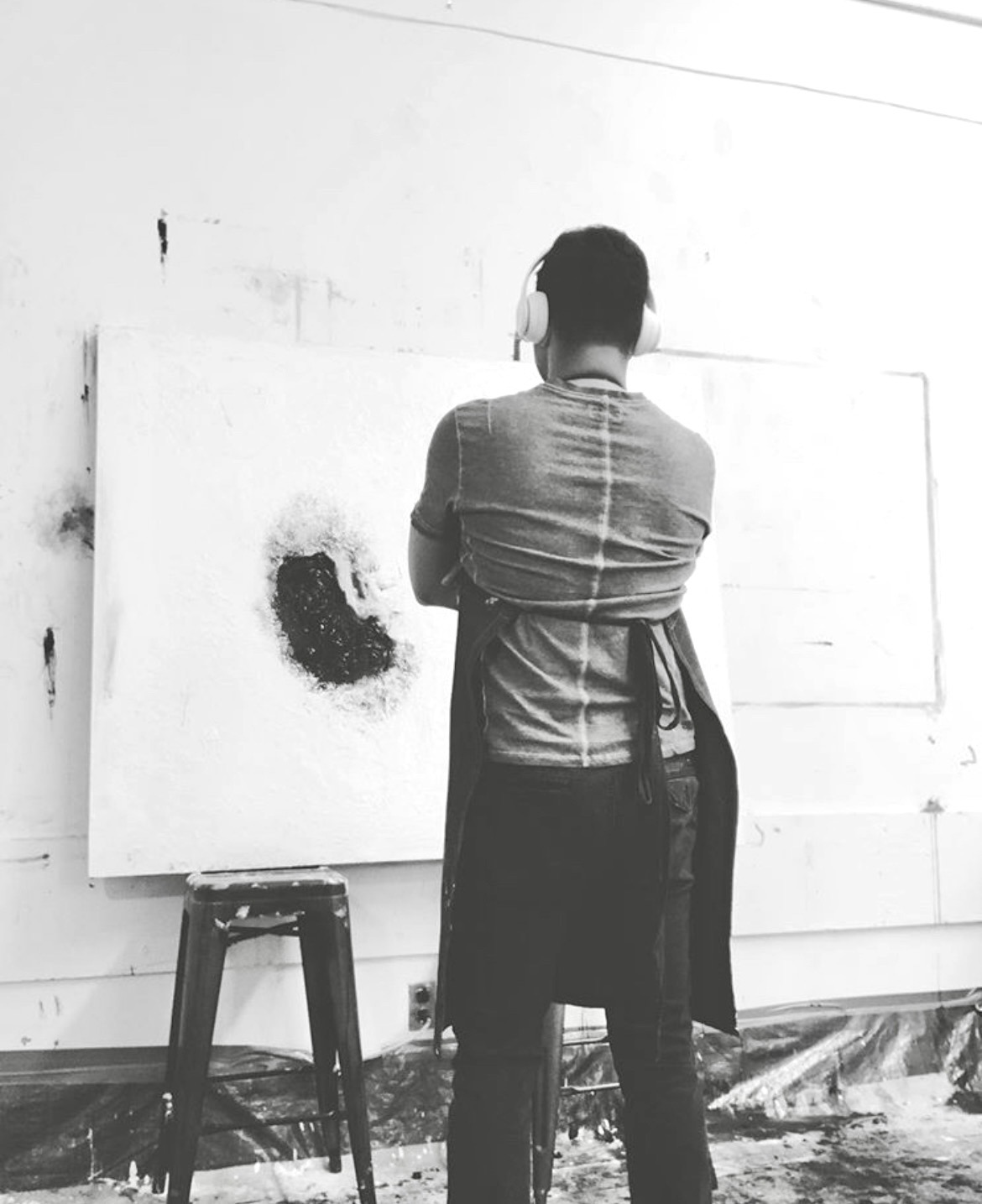 Anand working on an abstract painting in the studio